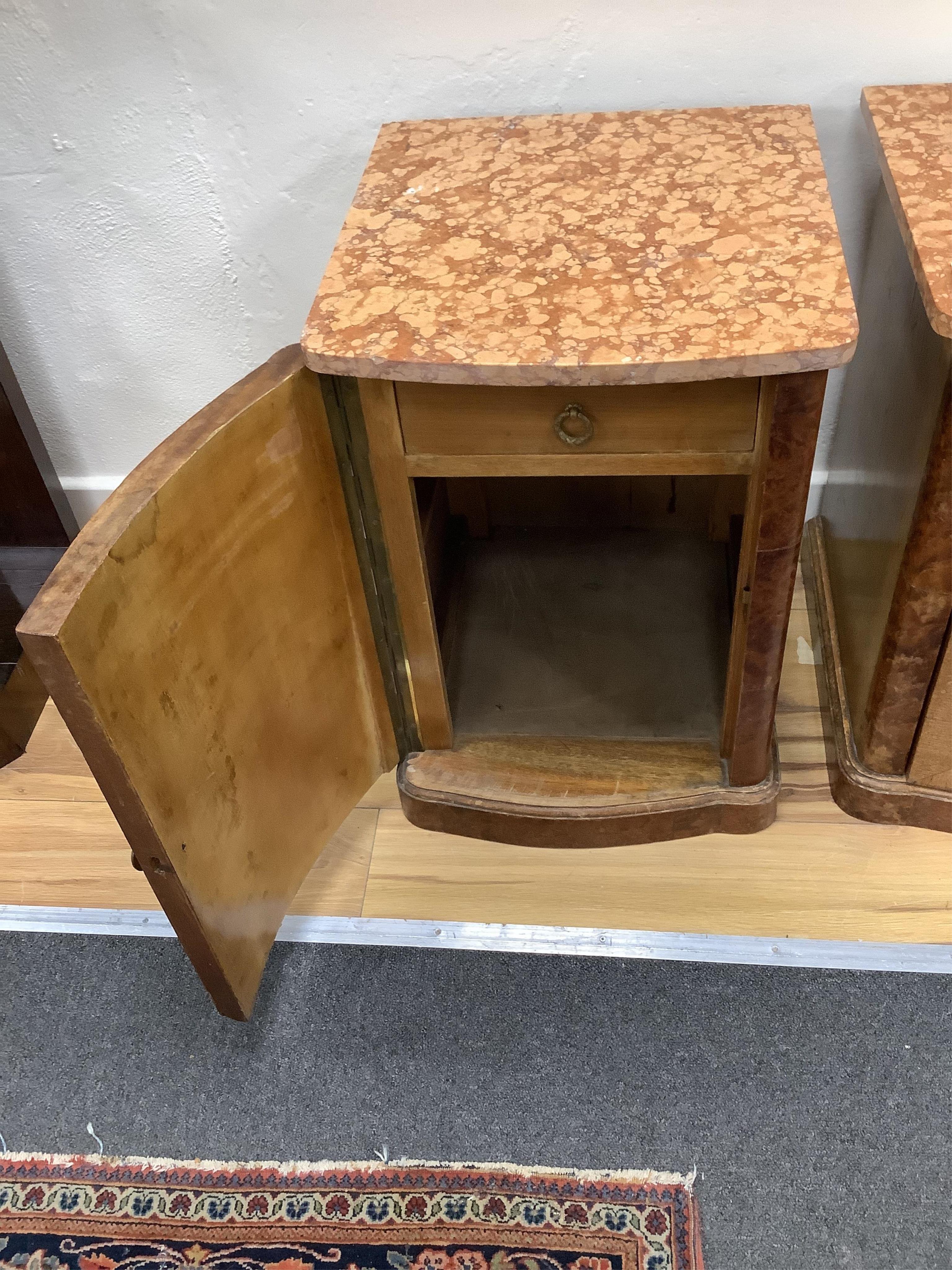 A pair of early 20th century French amboyna and mahogany marble top bedside cabinets, width 40cm, depth 43cm, height 58cm. Condition - fair